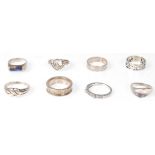 A collection of silver rings to include wheatsheaf, agate set, pave set, plain band ring, modernist,