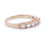 A hallmarked 9ct rose gold 5 stone ring. The ring set with 5 oval mixed cut morganites within a