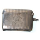 An early 20th Century silver hallmarked vesta case of square form having engraved striped decoration