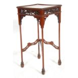 A 19th Century Victorian Chinese Chippendale mahogany center table / lamp table raised on shaped