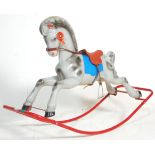 A vintage 20th Century Triang Toys rocking horse of plastic construction raised on a tubular metal