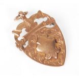 A lovely hallmarked 9ct yellow gold fob pendant brooch of shield shape form with a pendant bail atop