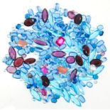 A mixed group of various coloured paste stones with many faceted cut in oval, round, square,