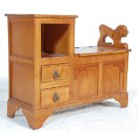 A mid century oak Jacobean revival telephone table - coffer chest combination. The hinged box seat