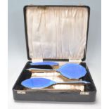 A silver hallmarked enamel backed Art Deco ladies boxed dressing table set. The silver handles
