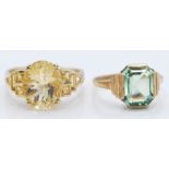Two hallmarked 9ct gold dressings. One Art Deco style ring set with green paste and another set with