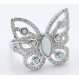 A stamped 925 silver ladies dress ring in the form of a butterfly having pierced wings set