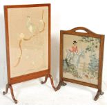 Two fire screens - An early 20th Century mahogany framed embroidered fire screen depicting a peacock