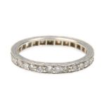 A 9ct white gold ladies diamond eternity ring set with twenty-five round cut diamonds and engraved