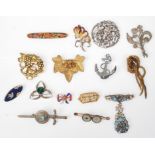 A collection of fifteen vintage 20th Century brooches to include a Christian Dior knot brooch,