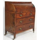A 19th Century George III flame mahogany cylinder top writing bureau desk having a bank of thee