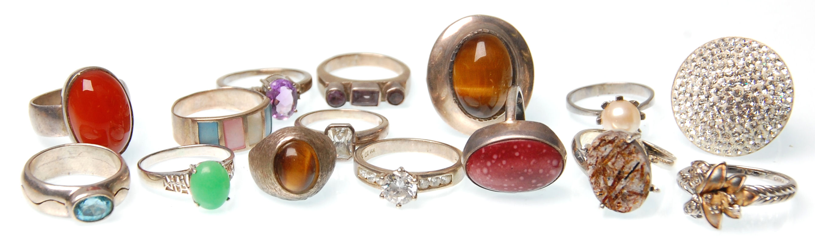 A collection of fifteen vintage silver rings to include two rings set with tigers eye, a redstone