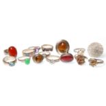 A collection of fifteen vintage silver rings to include two rings set with tigers eye, a redstone