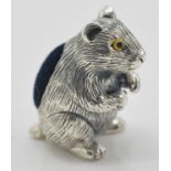 A stamped 925 silver pincushion in the form of a hamster with yellow glass eyes and a blue velvet