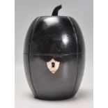 A Georgian style ebonised fruit wood tea caddy in the form of a cantaloupe / melon having a shield