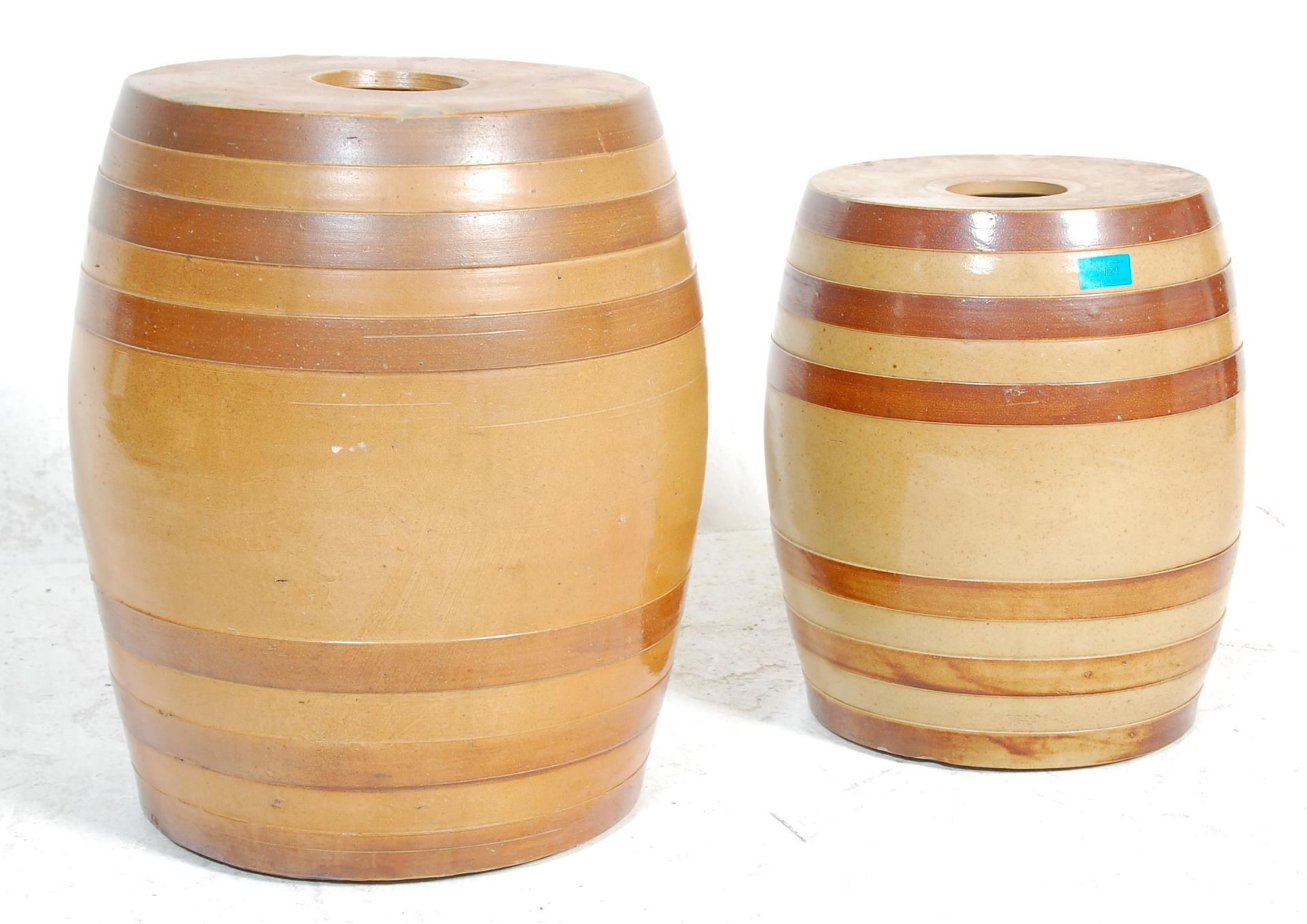 Two 19th Century Victoria antique stoneware wine barrels having brown glazed banded decoration. 50cm
