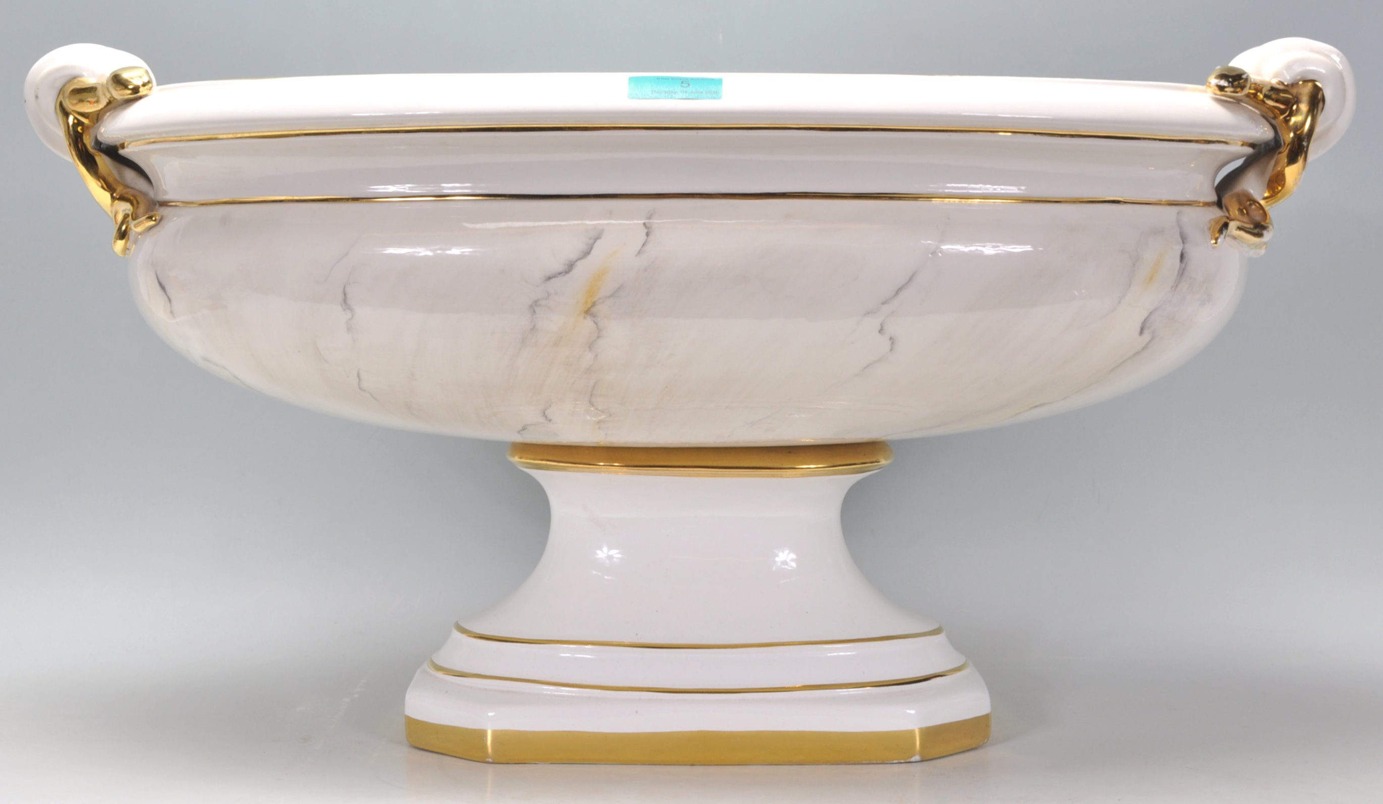 A good large ceramic urn planter of oval form having gilt banding with gilt ribbon decoration to the