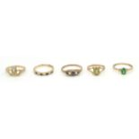 5 hallmarked 9ct gold rings to include an oval peridot in rub over setting, a claddah ring with