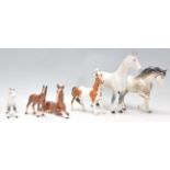 A group of five Beswick ceramic horse figurines to