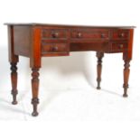 A Victorian 19th century mahogany writing table desk. Raised on turned, tapering legs with central