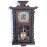 An early 20th Century mahogany cased Vienna regulator style pendulum wall clock having a glazed