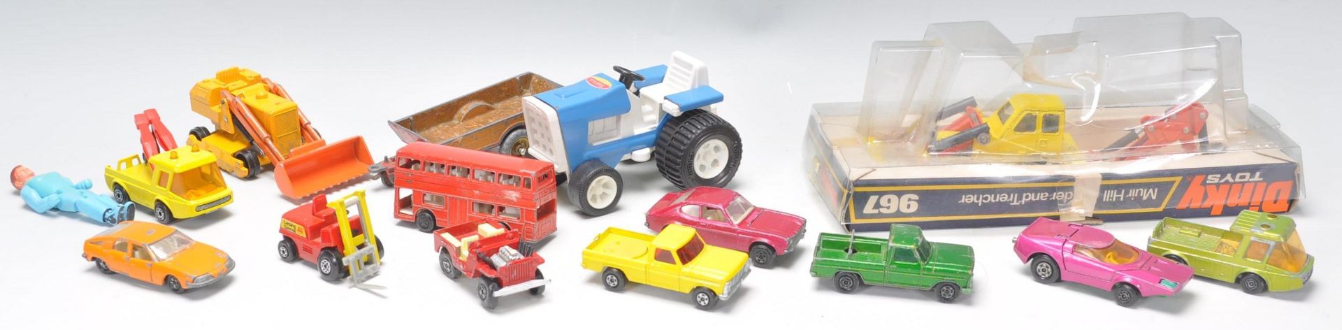 A collection of vintage diecast toy vehicles to include a Dinky 967 Muir Hill Loader and Trencher,