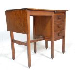 An early 20th Century, circa 1920's oak desk of small proportions having a bank of three drawers