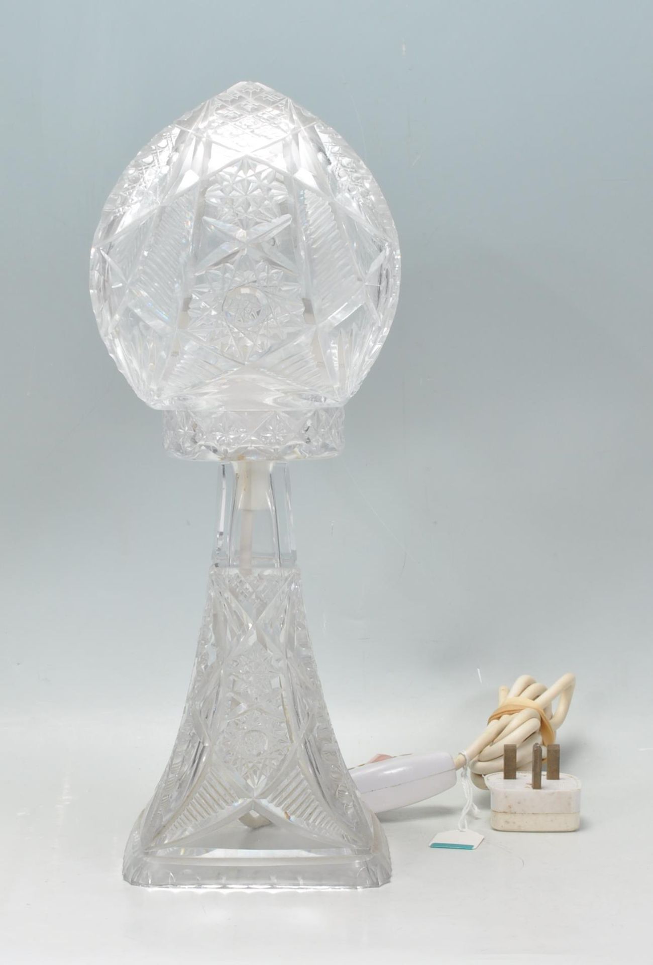 A fine 20th Century Edwardian cut crystal glass table / side lamp having a cut glass shade atop of a