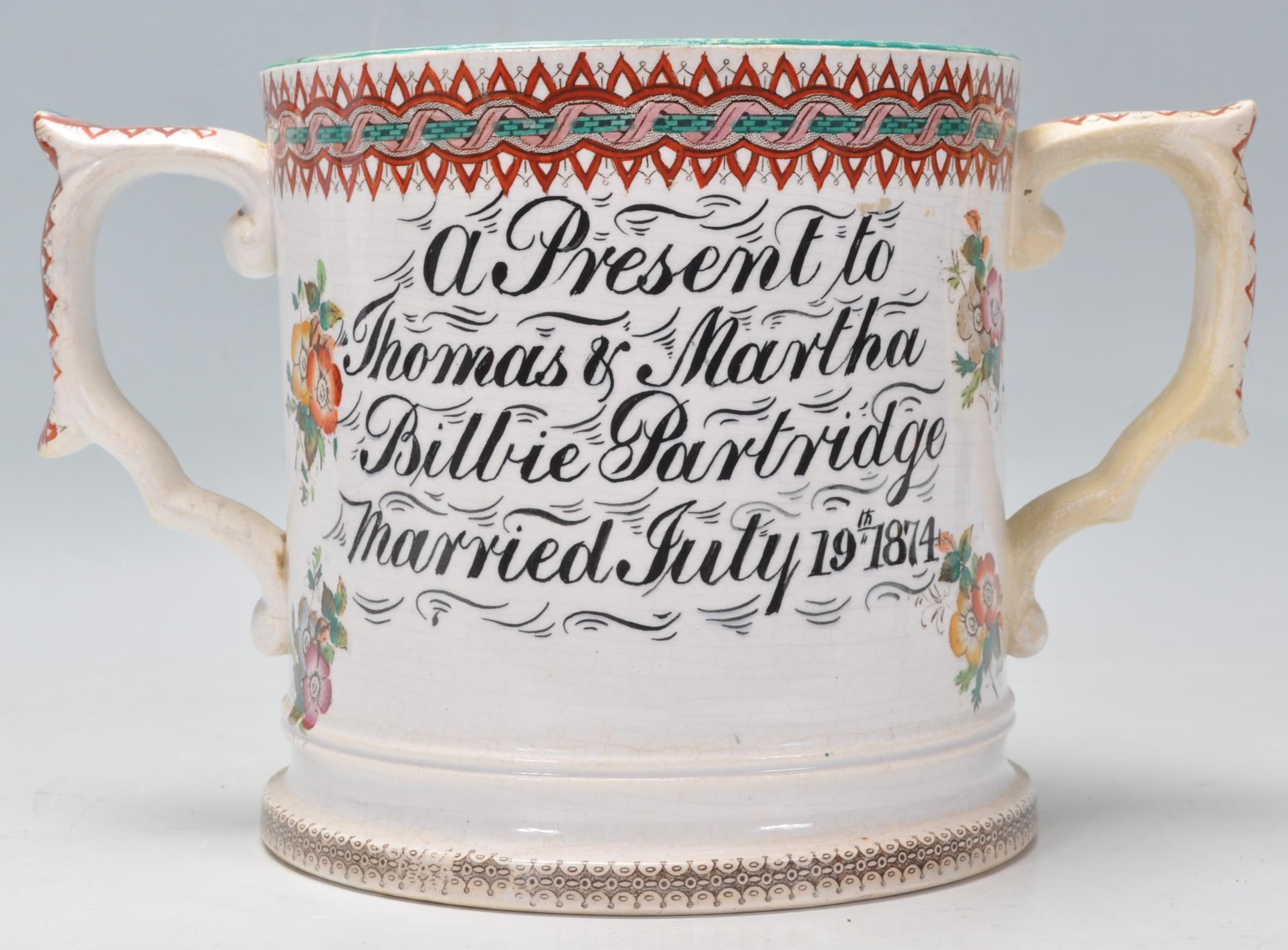 A 19th century Victorian Staffordshire twin handled marriage loving cup - mug being cream glazed - Image 3 of 7