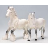 A  collection of 2 Beswick horse porcelain figurines to include 2 dapple grey coloured horses, one