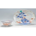 A late 18th / early 19th Century Chinese blue and white platter / plate hand painted in blue and