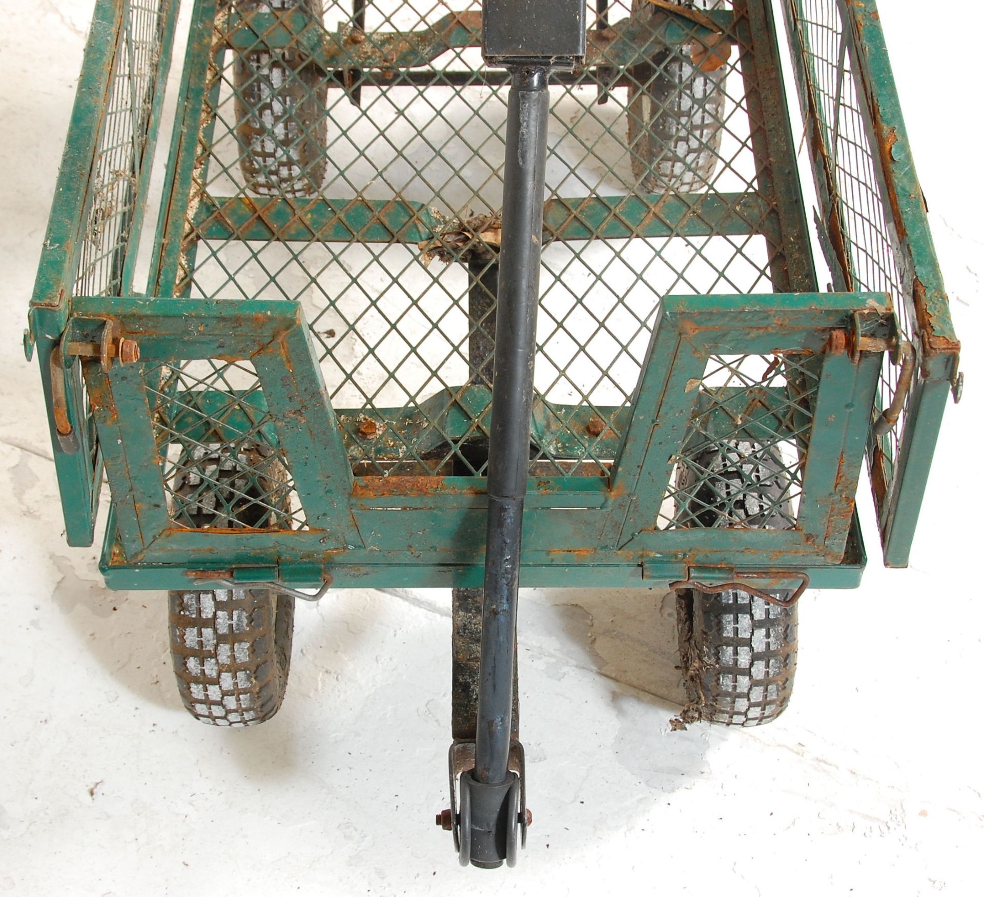 A metal four wheel pull along trolley finished in green with fold down sides. 85cm x 105cm x 55cm. - Bild 4 aus 10