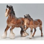 A  collection of Beswick horse porcelain figurines to include 2 bay coloured shire horses and 2