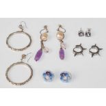 A mixed group of silver earrings to include a pair of heavy hoop examples, mystic topaz stud