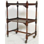 A good early 20th Century oak two tier tea trolley having a gallery topped back with four turned