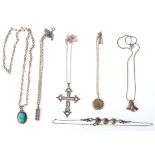 A selection of silver necklaces to include a bow design chain with a turquoise pendant, a snake