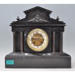 A 19th Century French movement slate Japy Freres mantel clock having a round face with a white