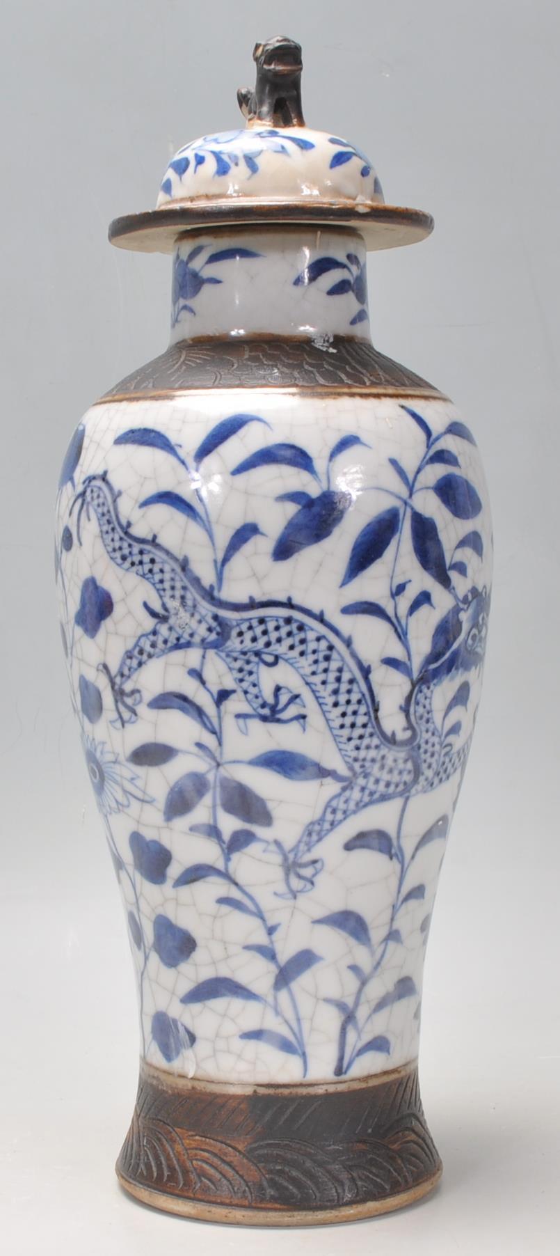 A late 19th Century Chinese blue and white lidded crackle glaze baluster vase having hand painted - Image 2 of 8