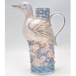 A lovely late 19th Century Chinese ceramic teapot moulded in the form of a Duck raised on a floral