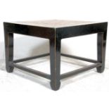 A 20th century retro Chinese inspired black lacquer coffee / occasional / lamp table. The table with