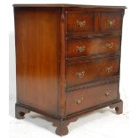 A good 20th century George III revival mahogany bachelors chest of drawers being raised on bracket