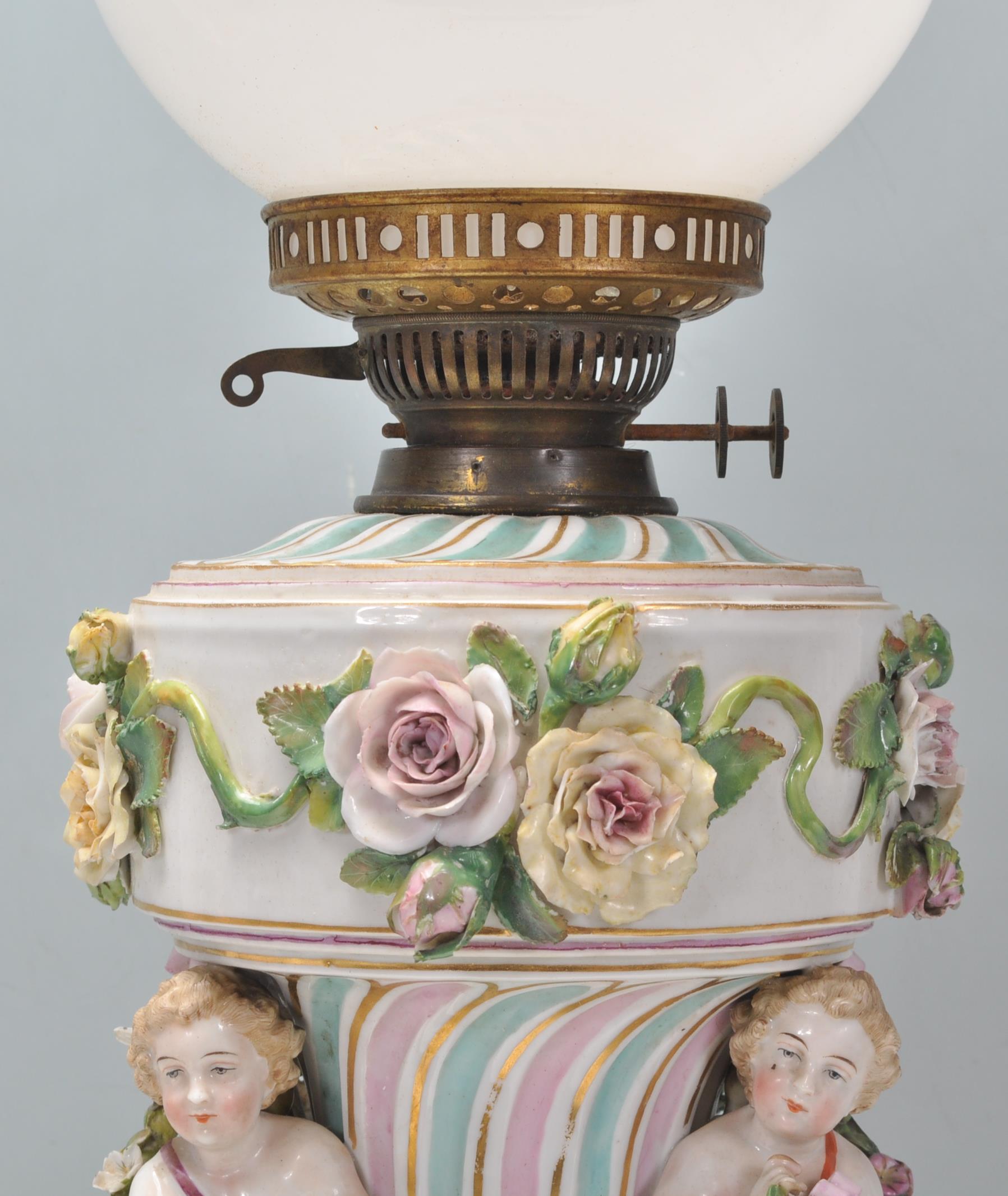 An antique German porcelain Dresden / Sitzendorf style oil lamp of large proportions, the body - Image 4 of 23
