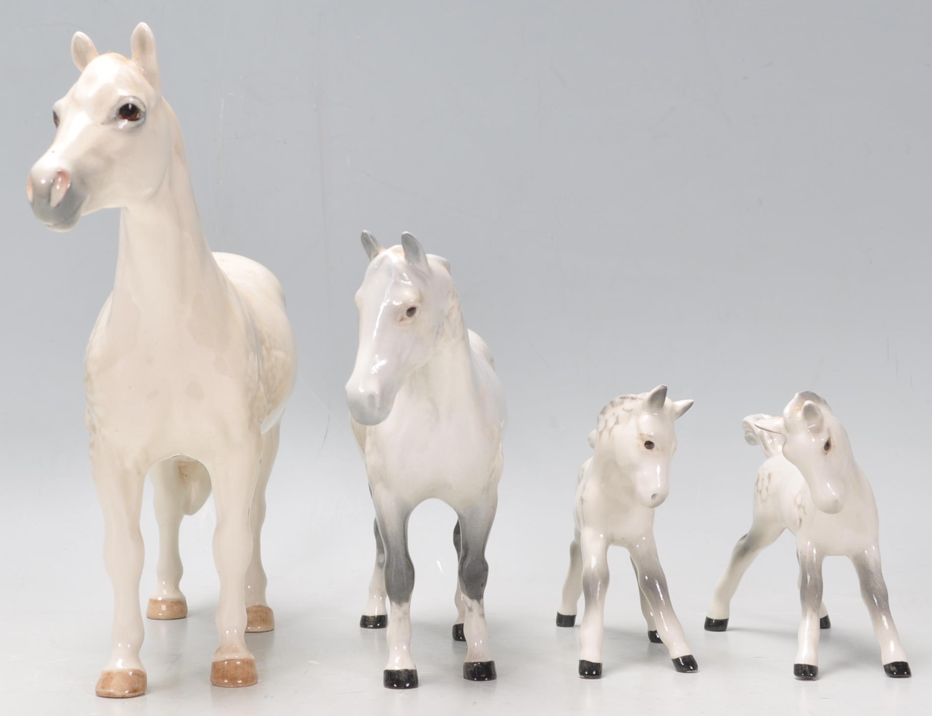 A  collection of 2 Beswick horse porcelain figurines to include 2 dapple grey coloured mares, all - Image 2 of 8