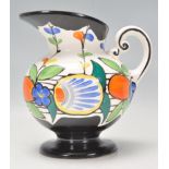 A vintage 20th Century Art Deco ceramic jug by Ditmar Urbach Czech having hand painted floral