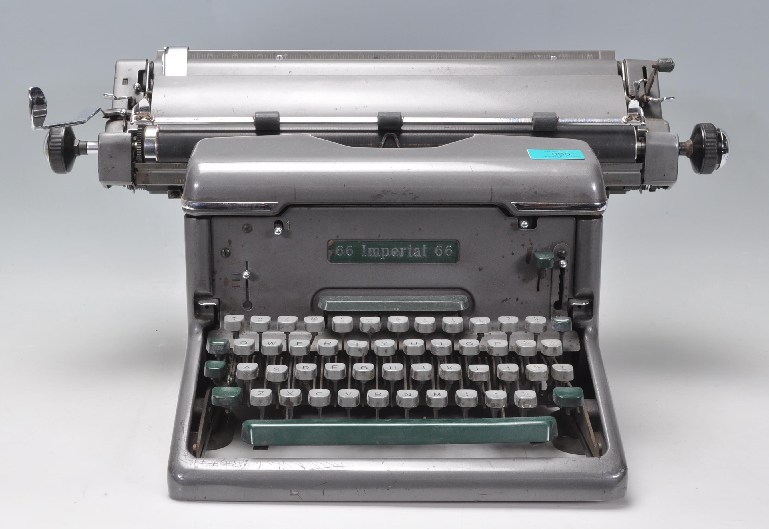 An early 20th Century vintage industrial manual typewriter by Imperial, having an A3 roller and