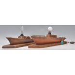 A pair of vintage retro 20th Century wooden lamps in the form of sailing boats.