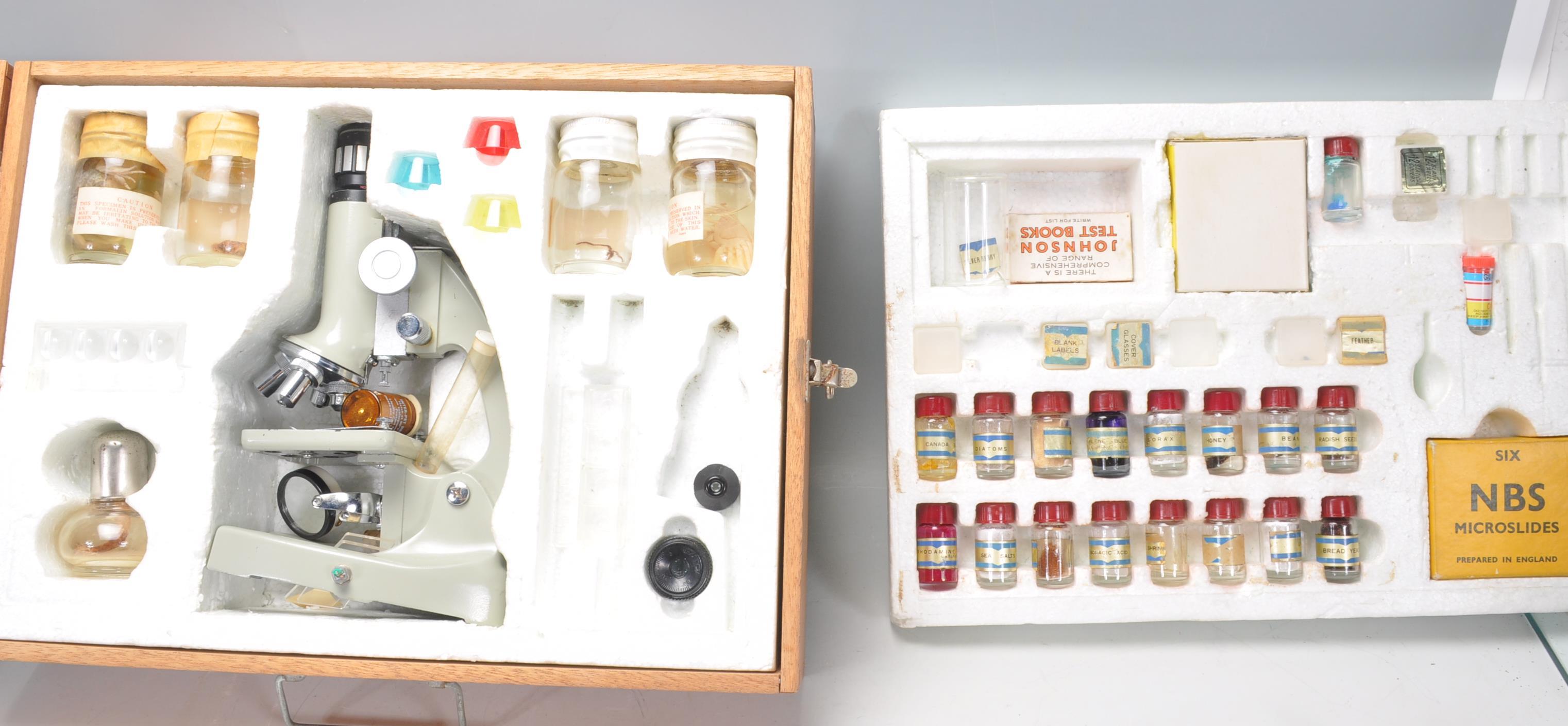 A vintage retro young Scientist microscope set complete with most accessories with preserved