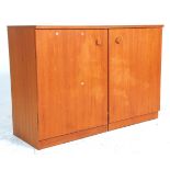 A mid century Danish influenced teak wood cabinet - cube desk combination. Raised on plinth bases