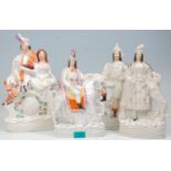A group of four 19th Century Victorian Staffordshire ceramic figurines to include a male figurine