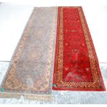 A good quality early 20th century Persian / Islamic floor rug runner having a dark red ground with